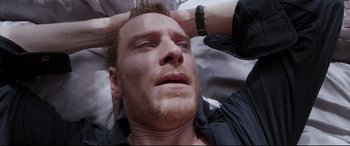 Movie still from “Song to Song” (2017), directed by Terrence Malick – A person laying on the ground; Close Up shot, Overhead angle