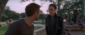 Movie still from “Song to Song” (2017), directed by Terrence Malick – A man and a woman talking on a porch; Medium shot, Over the shoulder angle