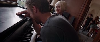 Movie still from “Song to Song” (2017), directed by Terrence Malick – A man and a woman sitting at a piano together; Close Up shot, Over the shoulder angle