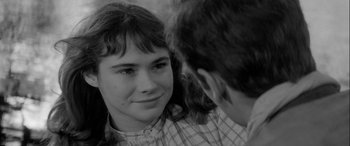Movie still from “Sons and Lovers” (1960), directed by Jack Cardiff – A young girl looking at a young boy; Close Up shot, Over the shoulder angle