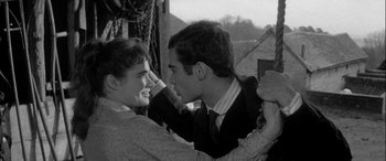 Movie still from “Sons and Lovers” (1960), directed by Jack Cardiff – A man and a woman are smiling at each other; Close Up shot, High angle