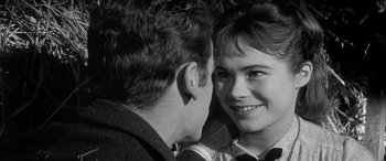 Movie still from “Sons and Lovers” (1960), directed by Jack Cardiff – A man and a woman looking into each others eyes; Close Up shot, Over the shoulder angle