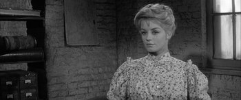 Movie still from “Sons and Lovers” (1960), directed by Jack Cardiff – A black and white photo of a woman in a dress; Close Up shot, Over the shoulder angle