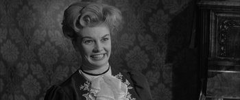 Movie still from “Sons and Lovers” (1960), directed by Jack Cardiff – An old photo of an older woman smiling for the camera; Close Up shot, Low angle