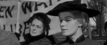Movie still from “Sons and Lovers” (1960), directed by Jack Cardiff – Two women in old - fashioned clothing sitting next to each other; Close Up shot, Over the shoulder angle