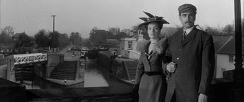 Movie still from “Sons and Lovers” (1960), directed by Jack Cardiff – An old photo of a woman with a hat on her head; Medium shot, Low angle