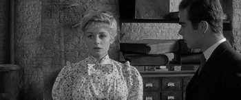 Movie still from “Sons and Lovers” (1960), directed by Jack Cardiff – A black and white photo of a woman in a dress; Close Up shot, Over the shoulder angle