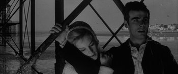 Movie still from “Sons and Lovers” (1960), directed by Jack Cardiff – A young woman is leaning against a wall; Close Up shot, Low angle