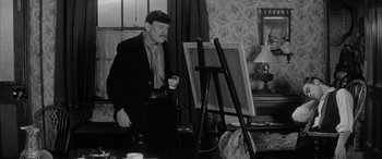 Movie still from “Sons and Lovers” (1960), directed by Jack Cardiff – An older man standing in front of a painting; Medium shot, Over the shoulder angle