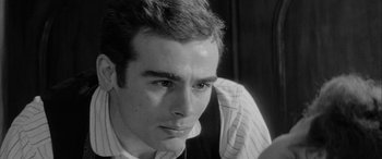 Movie still from “Sons and Lovers” (1960), directed by Jack Cardiff – Black and white photograph of a young man looking at the camera; Close Up shot, Over the shoulder angle