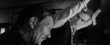 Movie still from “Sons and Lovers” (1960), directed by Jack Cardiff – An older man and a younger woman are looking at each other; Close Up shot, Over the shoulder angle