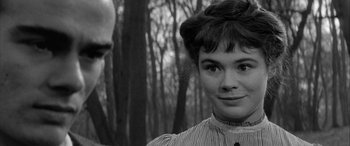Movie still from “Sons and Lovers” (1960), directed by Jack Cardiff – A woman in a striped shirt and a man in a forest; Close Up shot, Over the shoulder angle