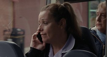 Movie still from “Sorry We Missed You” (2019), directed by Ken Loach – A woman sitting in a car talking on a cell phone; Close Up shot, Over the shoulder angle