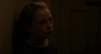 Movie still from “Sorry We Missed You” (2019), directed by Ken Loach – A young boy is looking into the dark; Close Up shot, Over the shoulder angle