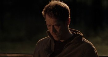 Movie still from “Sorry We Missed You” (2019), directed by Ken Loach – A person wearing a brown jacket; Close Up shot, Over the shoulder angle