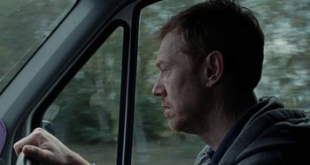 Movie still from “Sorry We Missed You” (2019), directed by Ken Loach – A person in a car; Close Up shot, Over the shoulder angle