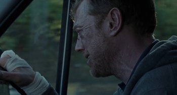 Movie still from “Sorry We Missed You” (2019), directed by Ken Loach – A person looking out a window; Close Up shot, Over the shoulder angle