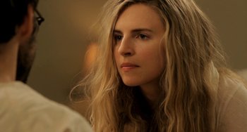 Movie still from “Sound of My Voice” (2011), directed by Zal Batmanglij – A person with long blonde hair; Close Up shot, Over the shoulder angle