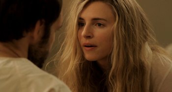 Movie still from “Sound of My Voice” (2011), directed by Zal Batmanglij – A person with long blonde hair; Close Up shot, Over the shoulder angle