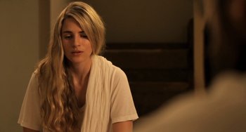 Movie still from “Sound of My Voice” (2011), directed by Zal Batmanglij – A beautiful young lady sitting in front of a mirror; Close Up shot, Over the shoulder angle