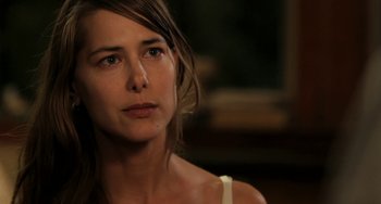 Movie still from “Sound of My Voice” (2011), directed by Zal Batmanglij – A person looking at the camera; Close Up shot, Over the shoulder angle