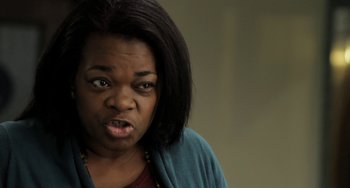 Movie still from “Sound of My Voice” (2011), directed by Zal Batmanglij – A person making a funny face; Close Up shot, Over the shoulder angle