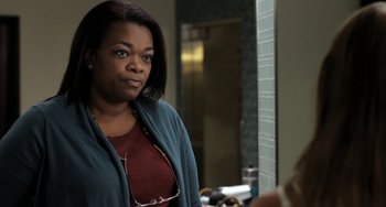 Movie still from “Sound of My Voice” (2011), directed by Zal Batmanglij – A woman standing in front of a bathroom mirror; Close Up shot, Over the shoulder angle