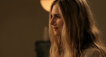 Movie still from “Sound of My Voice” (2011), directed by Zal Batmanglij – A person with long blonde hair; Close Up shot, Over the shoulder angle