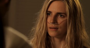 Movie still from “Sound of My Voice” (2011), directed by Zal Batmanglij – A person with long blonde hair; Close Up shot, Over the shoulder angle