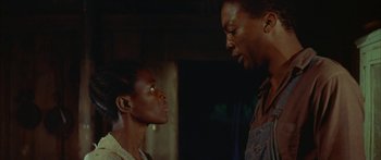 Movie still from “Sounder” (1972), directed by Martin Ritt – A man and a woman standing next to each other in a room; Close Up shot, Low angle