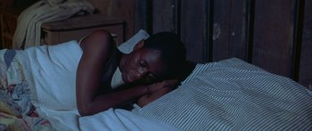 Movie still from “Sounder” (1972), directed by Martin Ritt – A woman laying in bed with her head on her pillow; Close Up shot, High angle