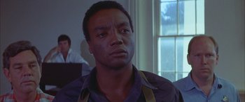 Movie still from “Sounder” (1972), directed by Martin Ritt – A person wearing a shirt and tie; Close Up shot, Low angle