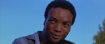 Movie still from “Sounder” (1972), directed by Martin Ritt – A man's face in the sunlight; Close Up shot, Low angle