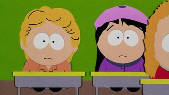 Movie still from “South Park: Bigger, Longer & Uncut” (1999), directed by Trey Parker – A couple of people sitting in front of a table; Medium shot, High angle