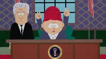 Movie still from “South Park: Bigger, Longer & Uncut” (1999), directed by Trey Parker – A woman with a red head is sitting in a court room; Medium shot, Low angle