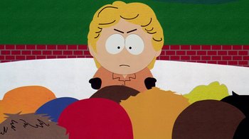 Movie still from “South Park: Bigger, Longer & Uncut” (1999), directed by Trey Parker – A character from south park; Medium shot, High angle