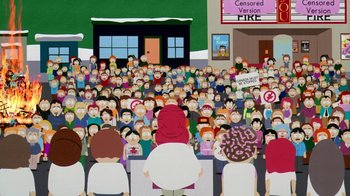 Movie still from “South Park: Bigger, Longer & Uncut” (1999), directed by Trey Parker – A crowd of people sitting and standing in front of a building; Wide shot, Overhead angle