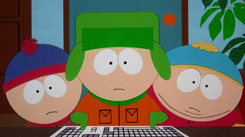Movie still from “South Park: Bigger, Longer & Uncut” (1999), directed by Trey Parker – A computer screen with a cartoon character on it; Medium shot, Overhead angle