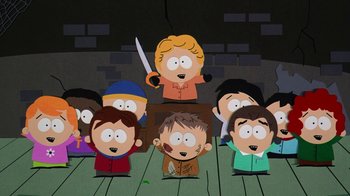 Movie still from “South Park: Bigger, Longer & Uncut” (1999), directed by Trey Parker – A group of people standing in front of a stage; Wide shot, High angle