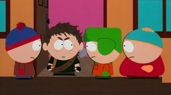 Movie still from “South Park: Bigger, Longer & Uncut” (1999), directed by Trey Parker – A group of people standing next to each other in front of a wall; Medium shot, Over the shoulder angle