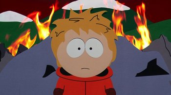 Movie still from “South Park: Bigger, Longer & Uncut” (1999), directed by Trey Parker – A cartoon of a boy in front of a fire background; Close Up shot, High angle