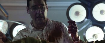 Movie still from “Southbound” (2015), directed by Tyler Gillett – A man in a white dress shirt with blood all over his face; Close Up shot, Low angle