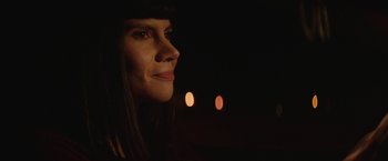 Movie still from “Southbound” (2015), directed by Tyler Gillett – A person looking at the camera; Close Up shot, Over the shoulder angle