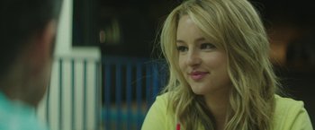 Movie still from “Southbound” (2015), directed by Tyler Gillett – A beautiful blonde woman with a yellow shirt; Close Up shot, Over the shoulder angle