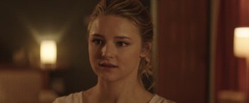 Movie still from “Southbound” (2015), directed by Tyler Gillett – A person wearing a white shirt; Close Up shot, Over the shoulder angle