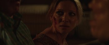Movie still from “Southbound” (2015), directed by Tyler Gillett – A person with blood on her face; Close Up shot, Over the shoulder angle