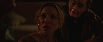 Movie still from “Southbound” (2015), directed by Tyler Gillett – A person looking at the camera; Close Up shot, Over the shoulder angle