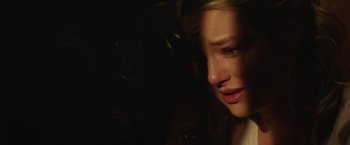 Movie still from “Southbound” (2015), directed by Tyler Gillett – A young blonde woman is looking down at her face; Close Up shot, High angle