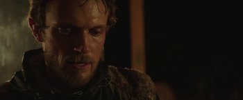 Movie still from “Southbound” (2015), directed by Tyler Gillett – A man's face in the dark; Close Up shot, Over the shoulder angle