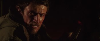 Movie still from “Southbound” (2015), directed by Tyler Gillett – A person with a beard; Close Up shot, Over the shoulder angle